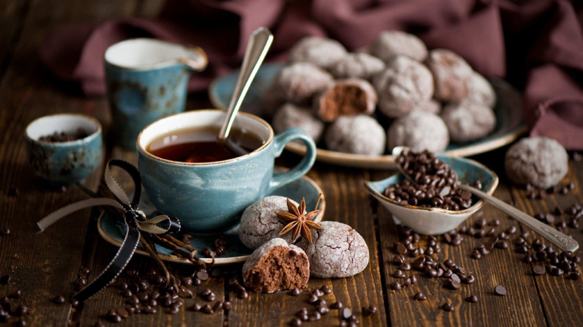 Coffee and cookies displayed on a table.